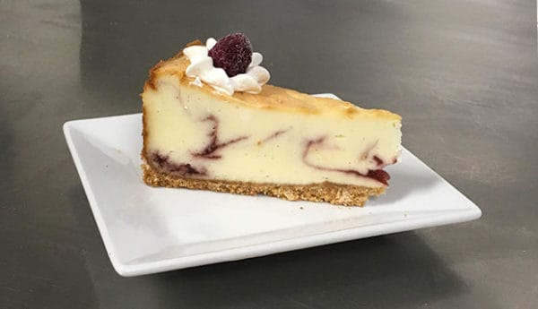 Slice of Raspberry White Chocolate Cheesecake